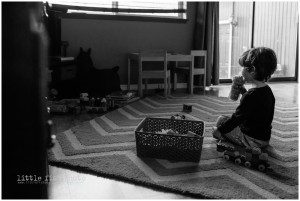 boy watches tv while drinking juice - Poulsbo Lifestyle Photography