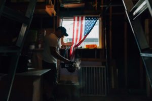 man using circular saw in garage