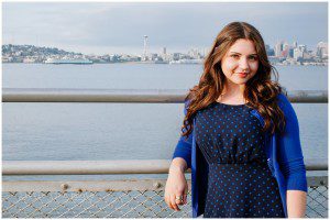 high school girl on alki beach with Seattle skyline