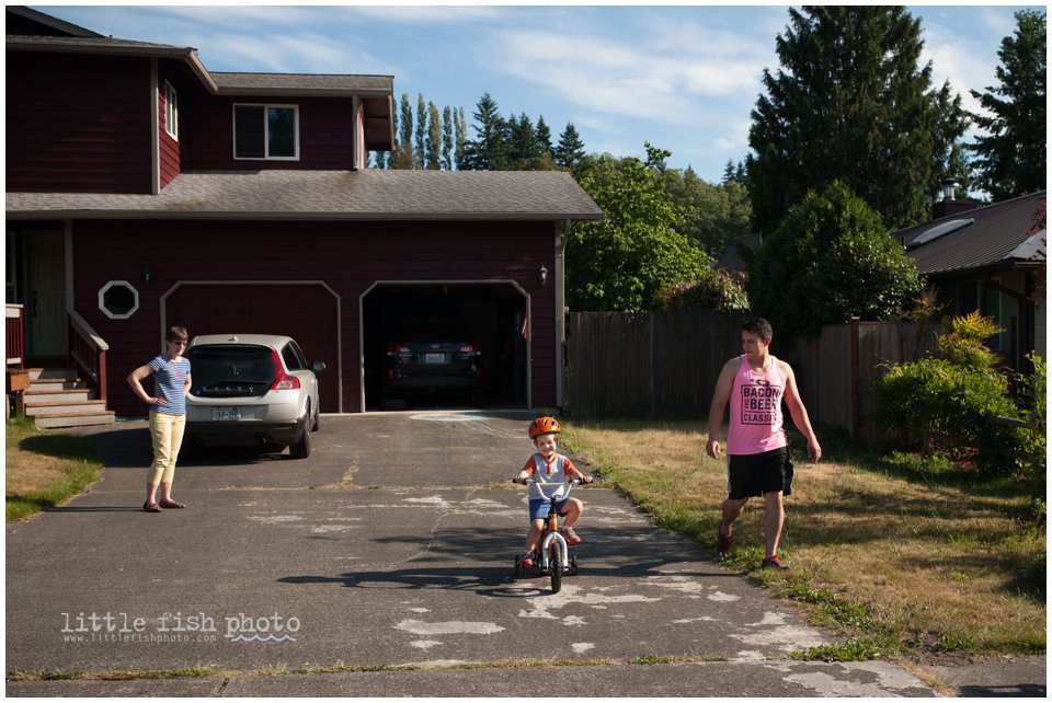 little boy rides bike