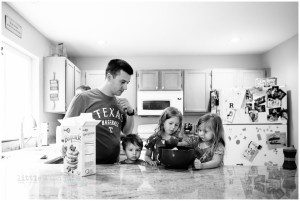 father and kids make pancakes