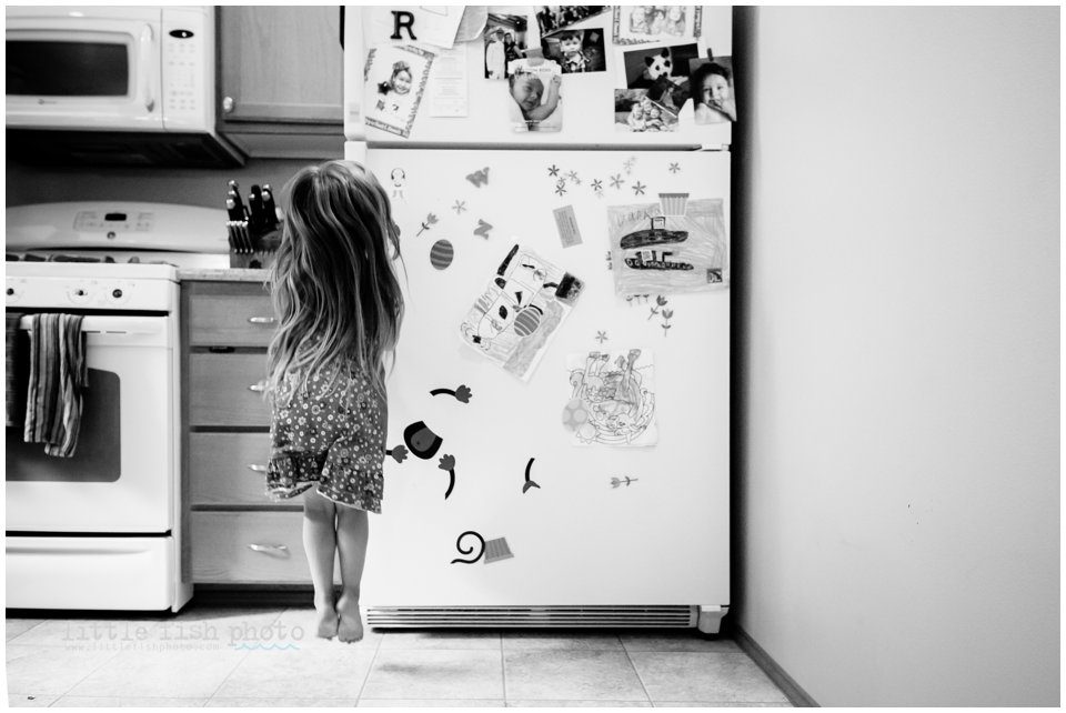 girl jumping by refrigerator - Family Photography