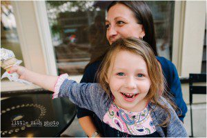 little girl laughing with ice cream