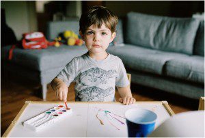 boy with watercolor paints - Kitsap Documentary Family photography