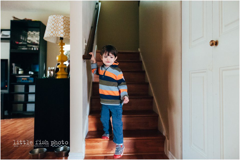 boy coming down the stairs