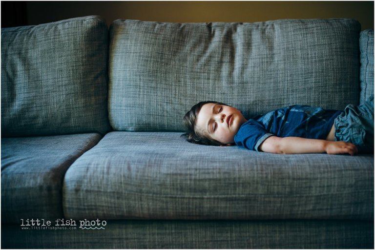 boy asleep on couch