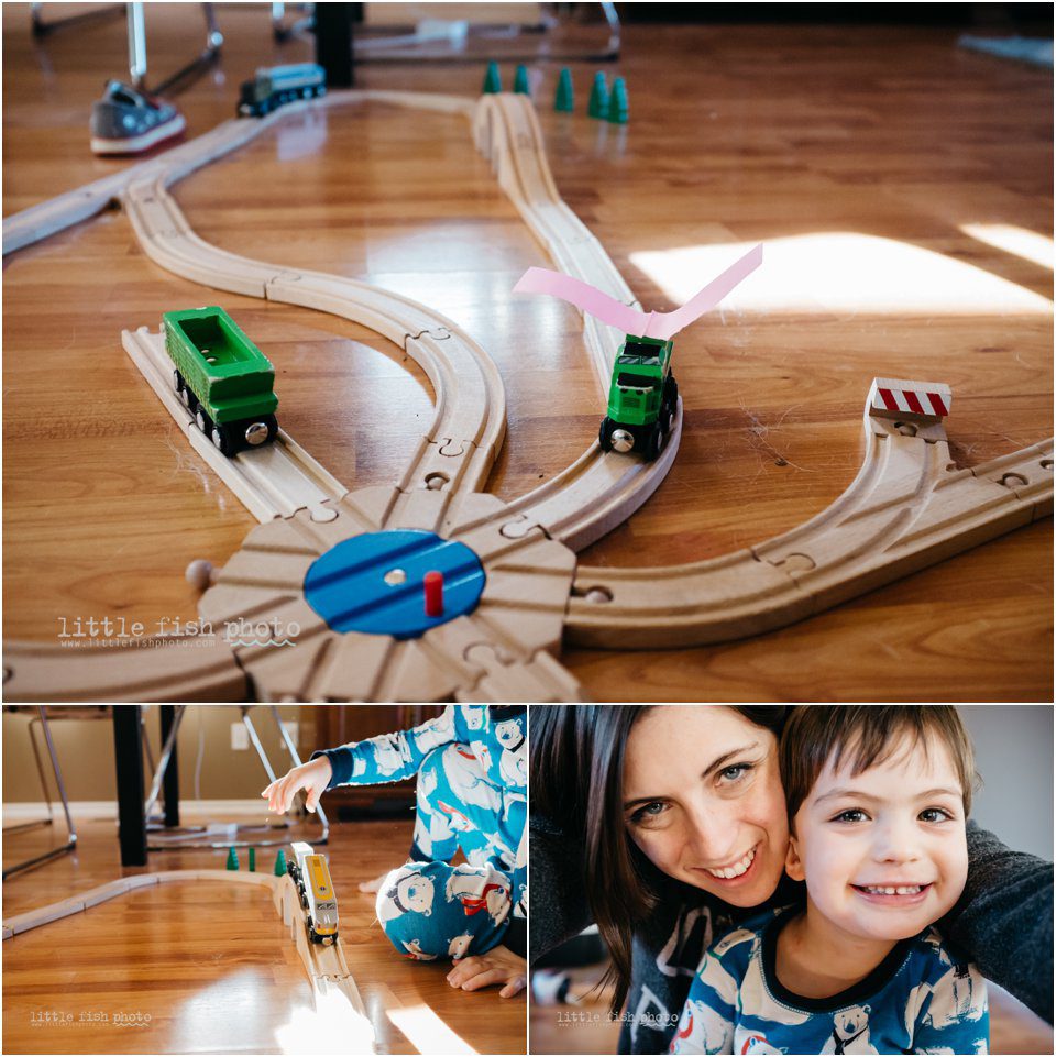 mom and three year old boy plays trains