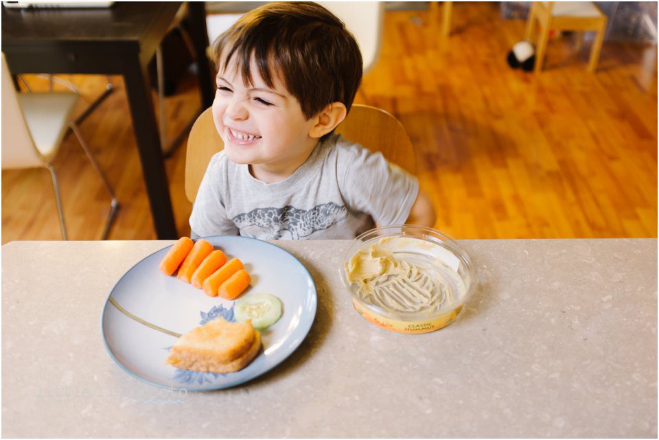 boy smiling with lunch