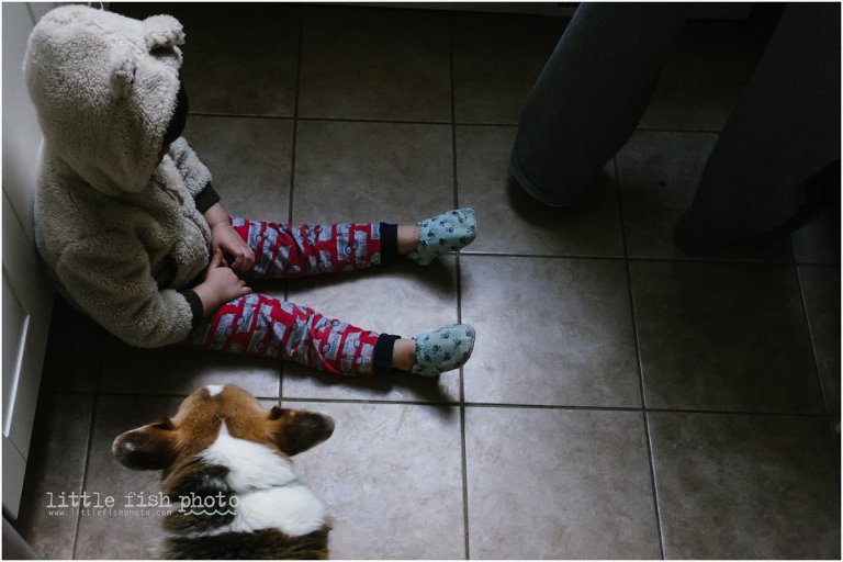 boy pouts on floor