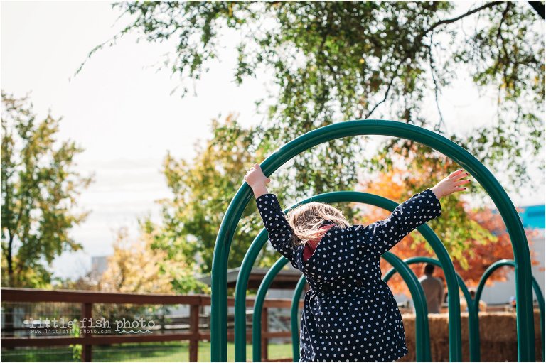 little girl on playground - Documentary Family Photographer
