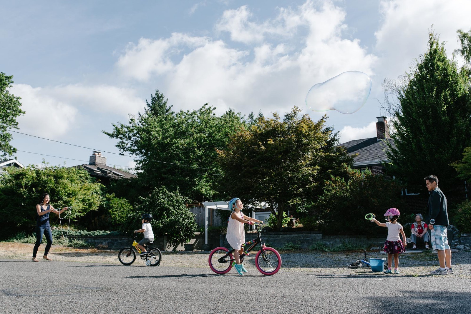 family playing in street