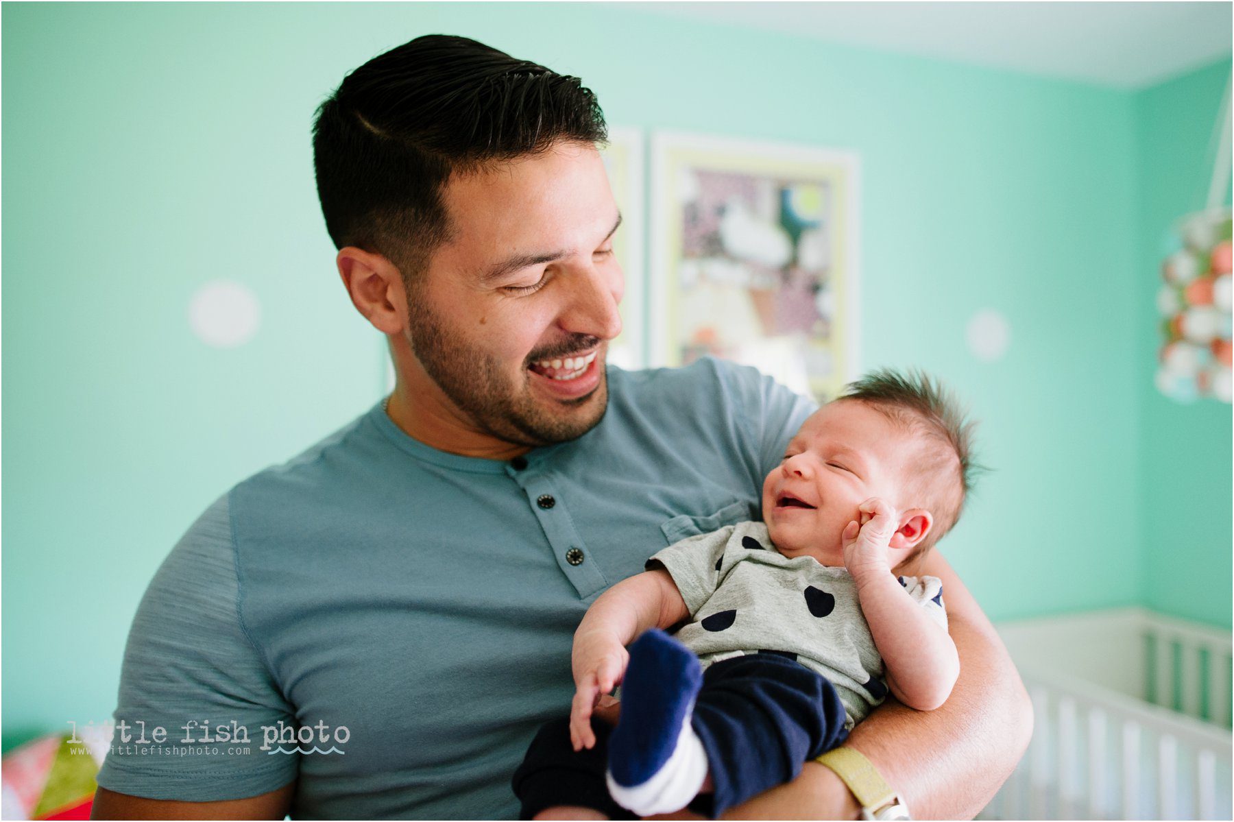 baby girl laughs with dad - Poulsbo Lifestyle Newborn Photographer