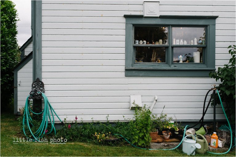 back of house with garden hose - Kitsap Lifestyle & Documentary Photographer