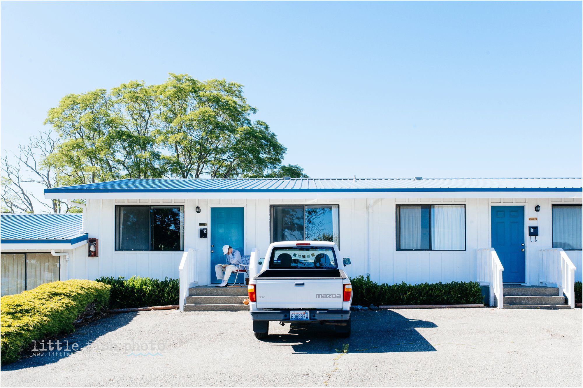 man reads outside hotel door -Kitsap Lifestyle & Documentary Photographer