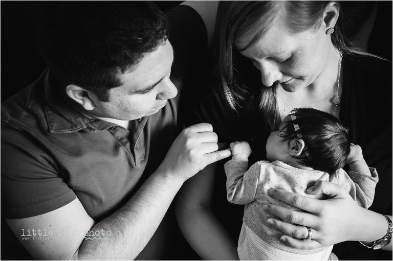family cuddles with newborn baby girl - Bremerton Lifestyle Newborn Photographer