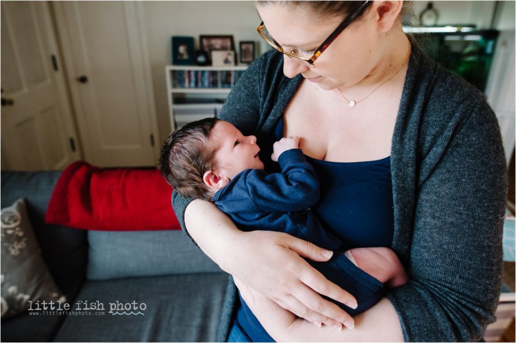 newborn baby boy gazes at mom