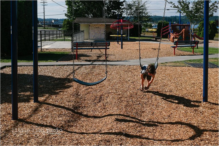 boy playing on swing - Kitsap Documentary Family Photographer