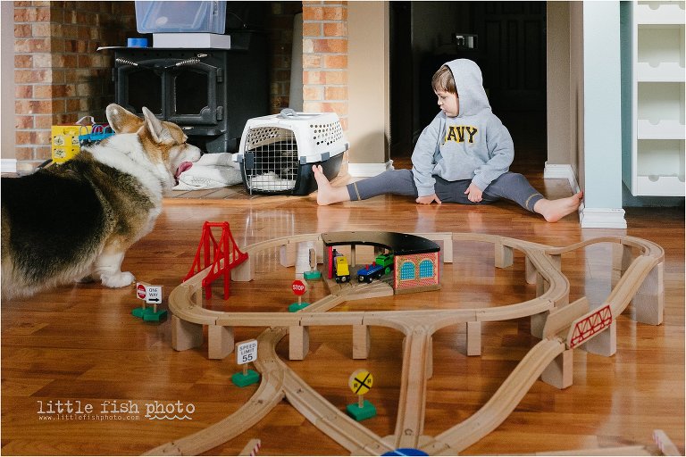 child plays with trains - Documentary Family photography