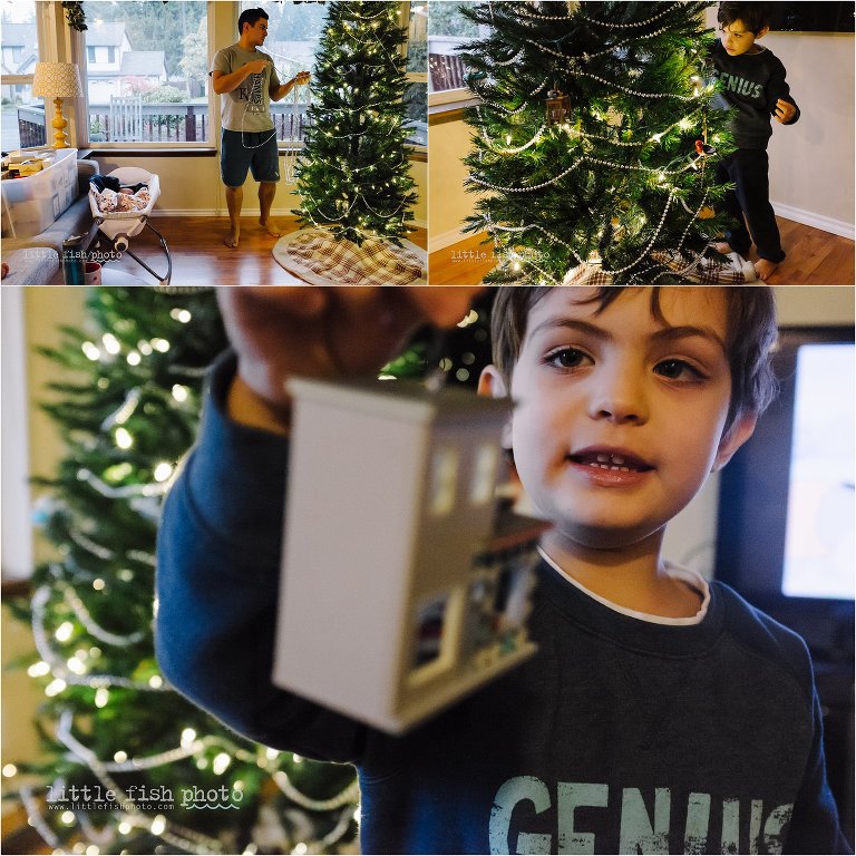 father and son decorate christmas tree