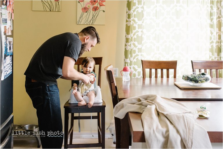 father wipes mess of boy in high chair - Bremerton Lifestyle Family Photographe