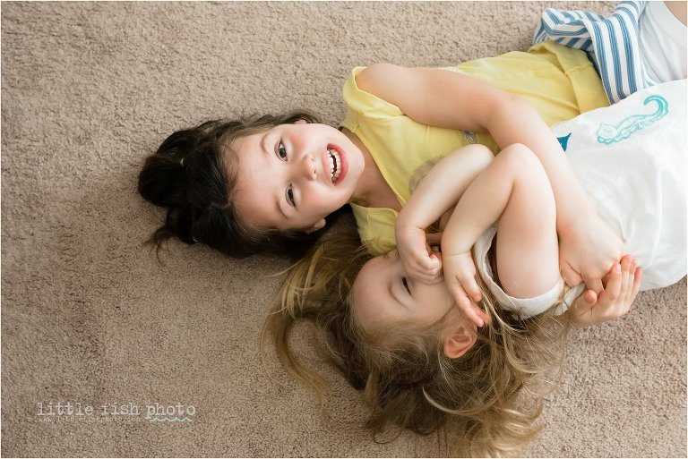 sisters wrestle on the ground