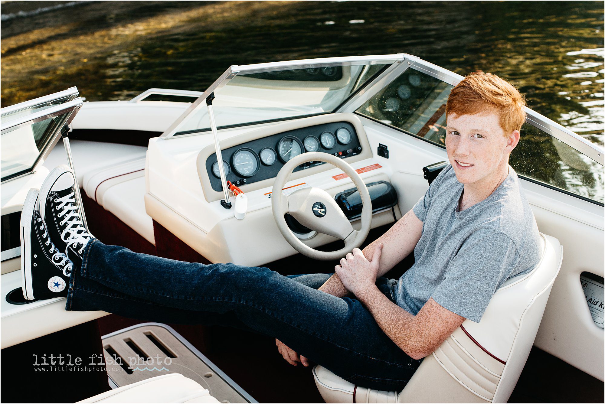 high school boy with red hair in boat - Bainbridge Island High School Senior Photographer