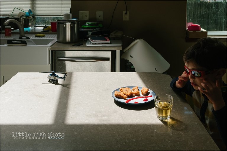boy with sunglasses and chicken nuggets - Documentary Family Photography
