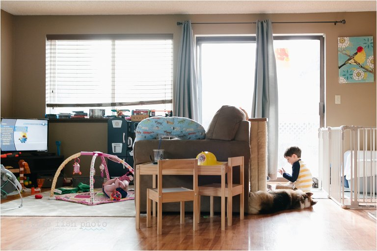 boy and baby in family room - Documentary Family Photography