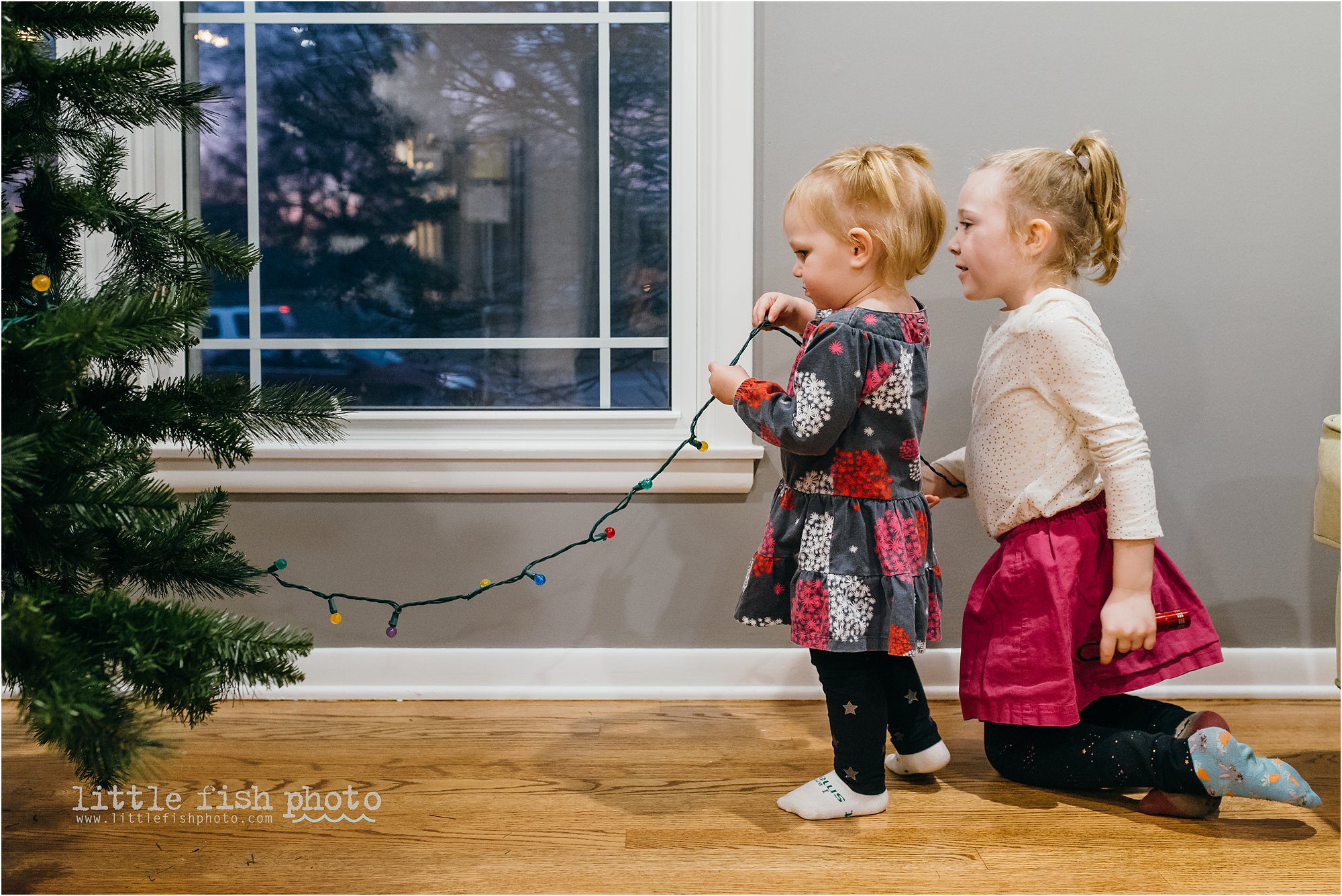 Girls with Christmas lights - Kansas City Documentary Family Photographer