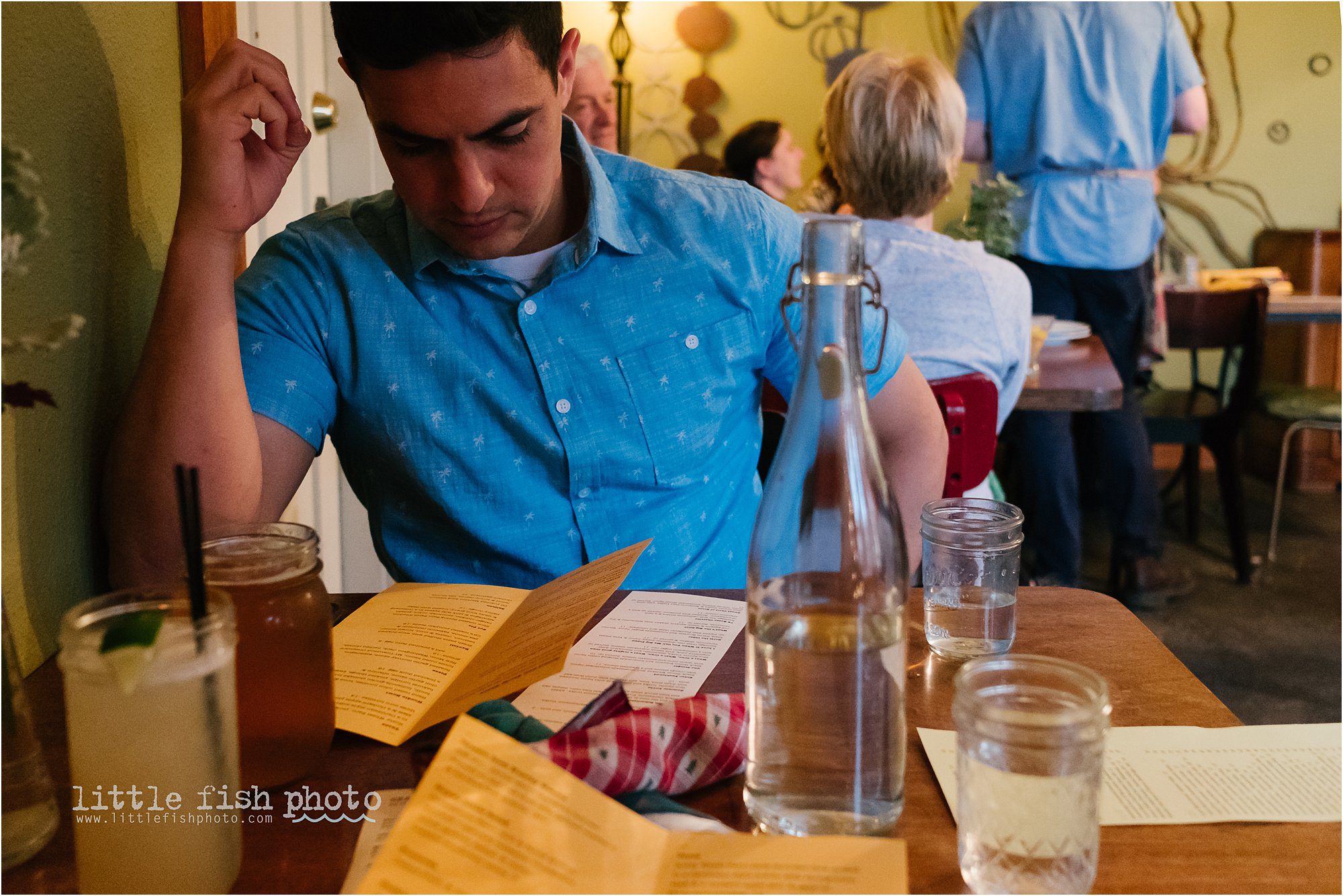 man examines menu