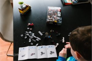 boy builds legos