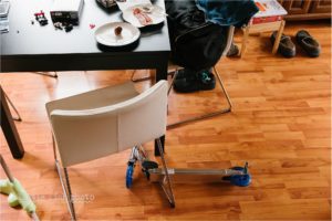 scooter left under kitchen chairs