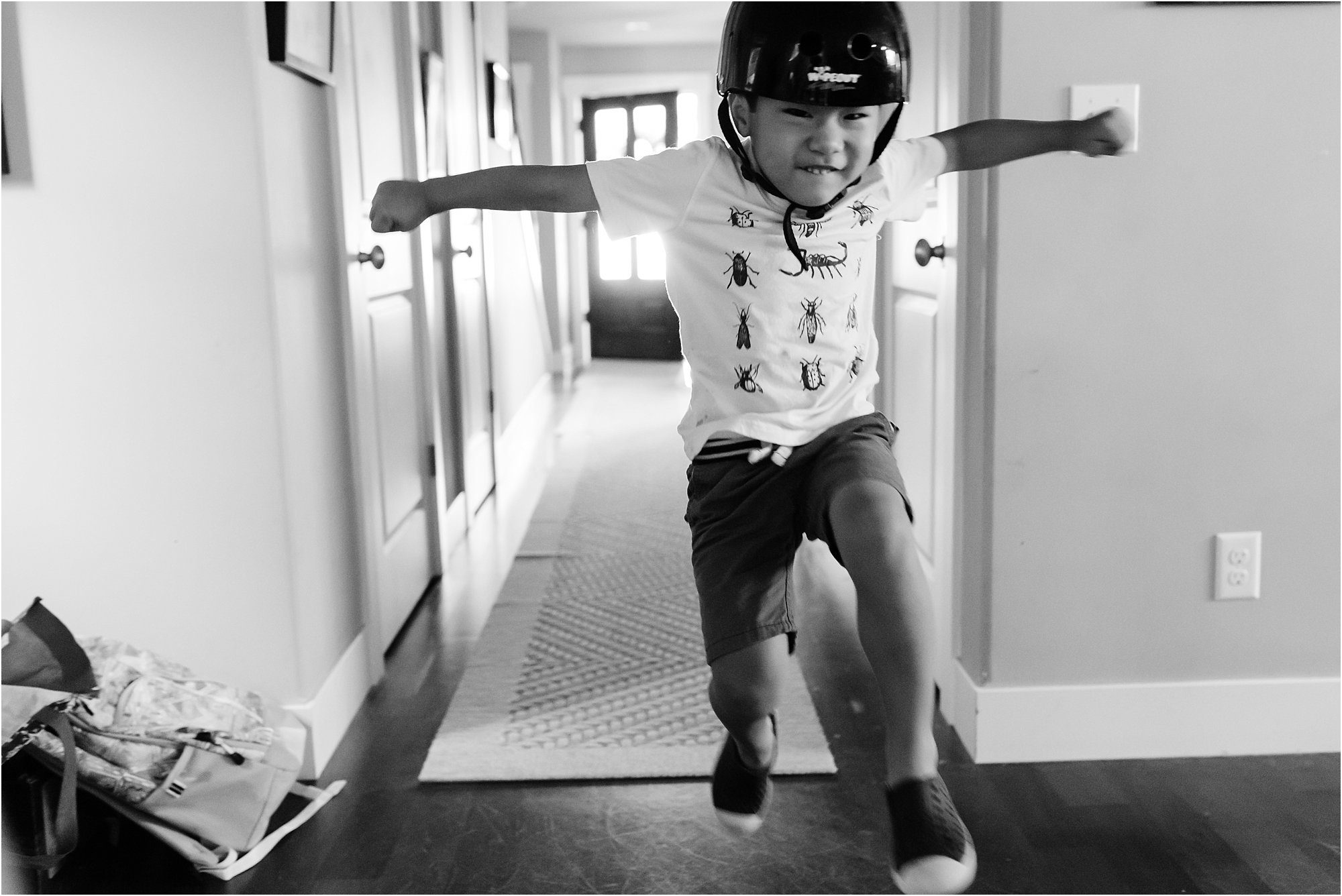 boy jumps in bike helmet - Seattle Documentary Family Photographer
