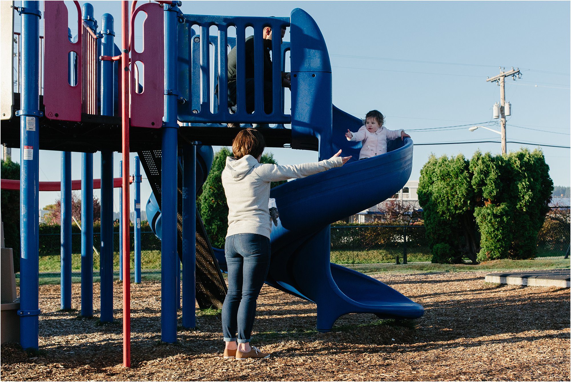 18 month old girl goes down slide - Kitsap Family Photographer
