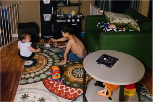 brother and sister play on floor- poulsbo documentary family photography