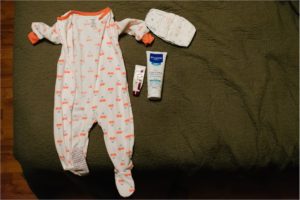 baby pajamas laid out