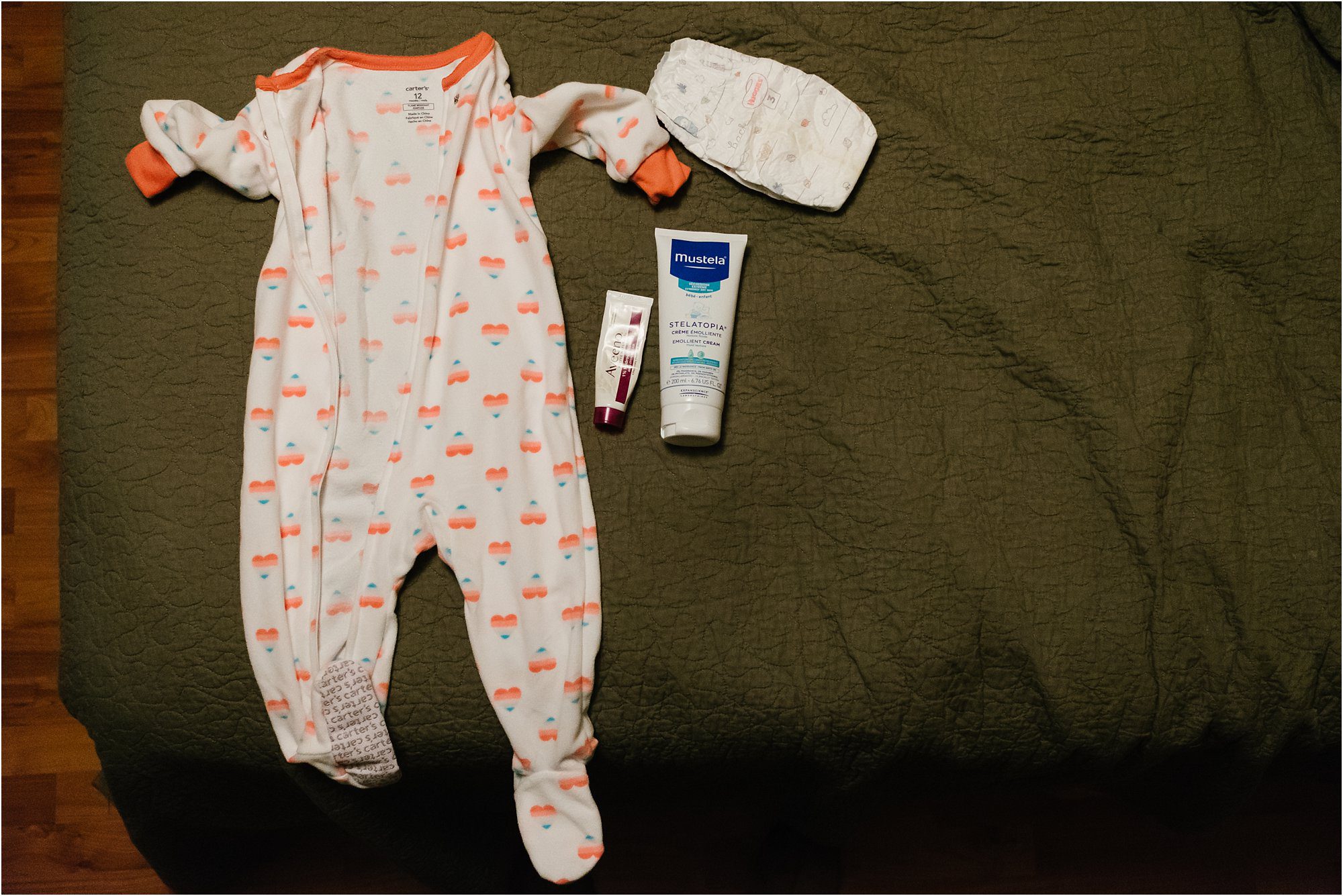 baby pajamas laid out