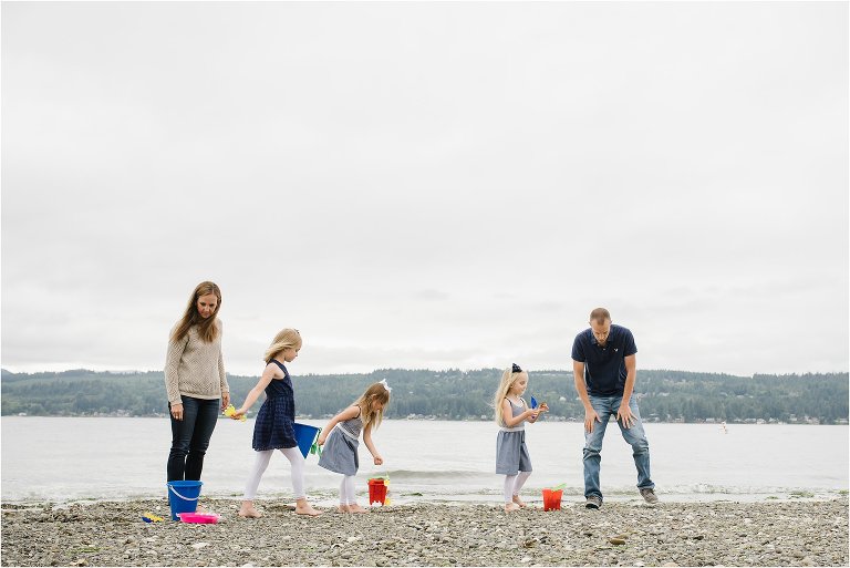 family on overcast beach