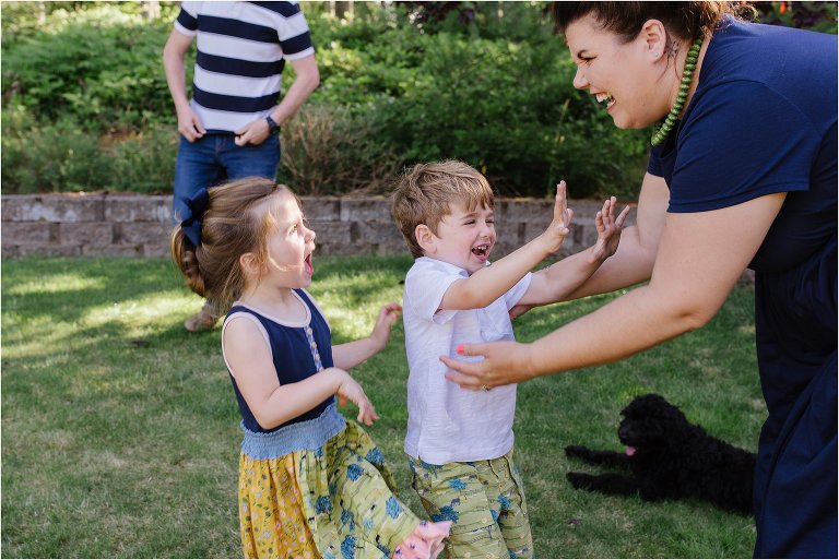 kids run to mom while pretending to be monsters