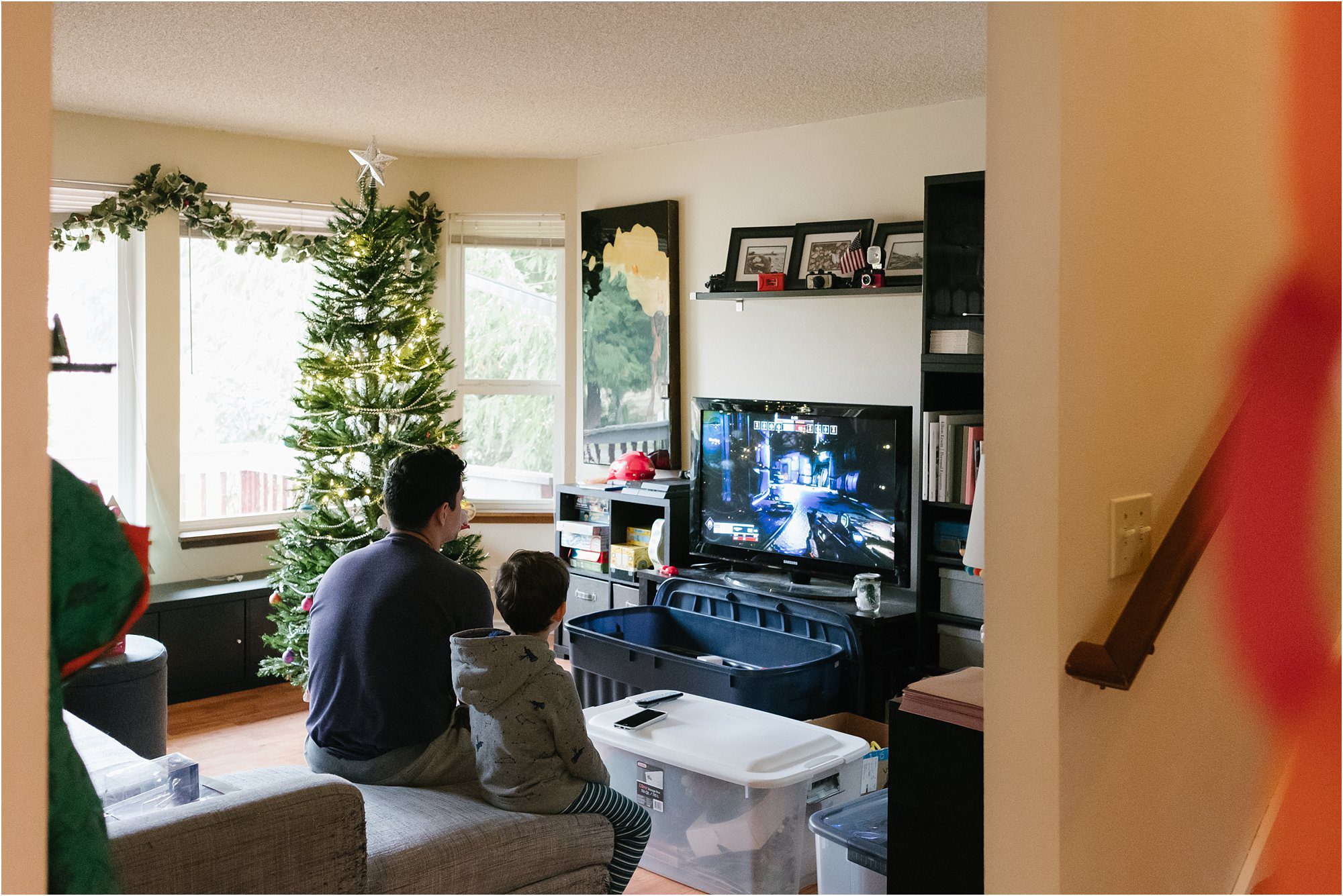 father and son playing video games
