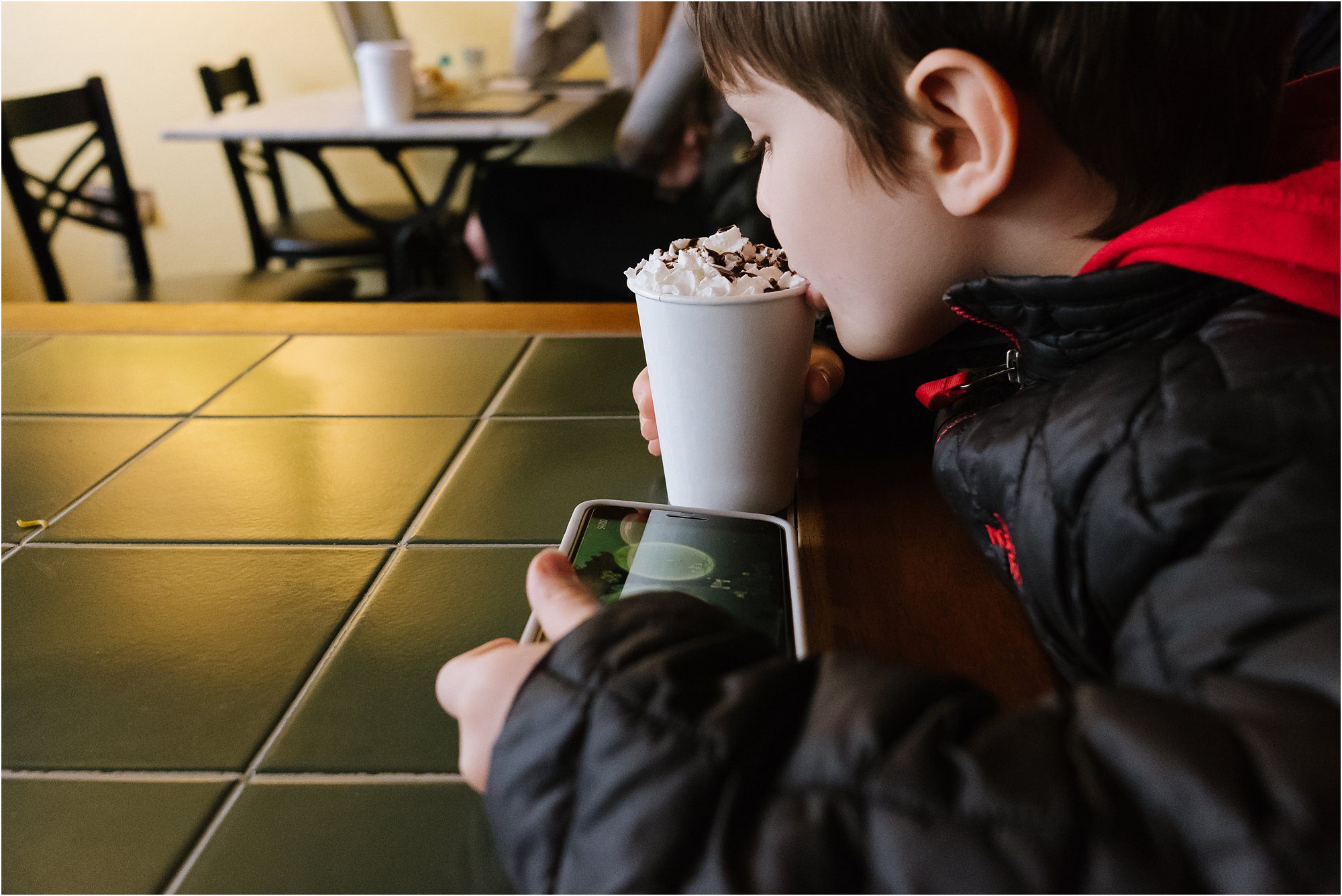 boy sipping hot chocolate