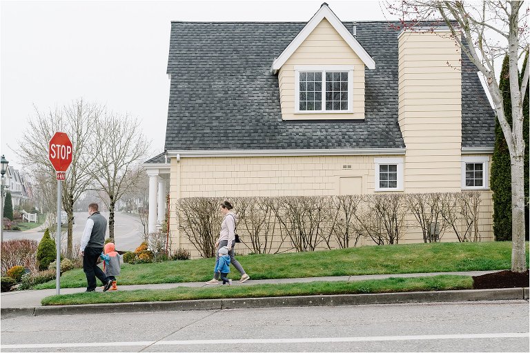 family walks down street together - Kitsap Lifestyle Family Photographer