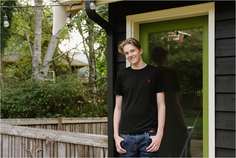 teen boy in front of green door- high school senior portrait - Bainbridge Island Photographer