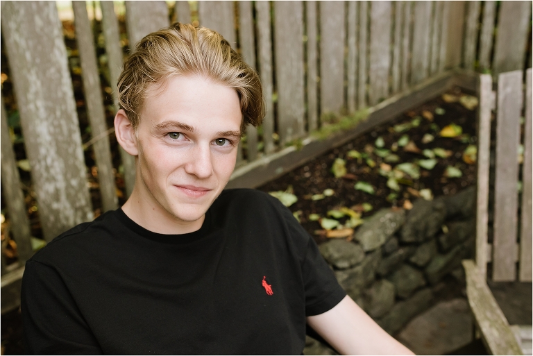 teen boy smirks at camera - high school senior portrait - Bainbridge Island Photographer