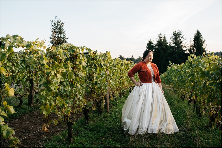 portrait of woman in wedding gown in vineyard